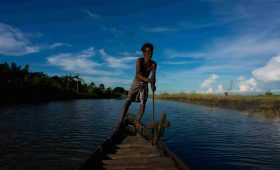 local man boating at majuli island